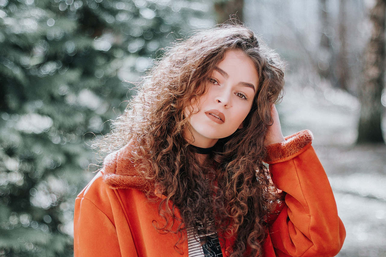 Woman in orange zip up jacket